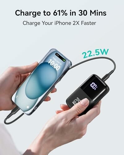 Hands holding a phone and portable charger showing 22.5W output