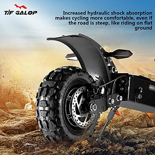 Off-road electric scooter with rugged tires on rocky terrain.